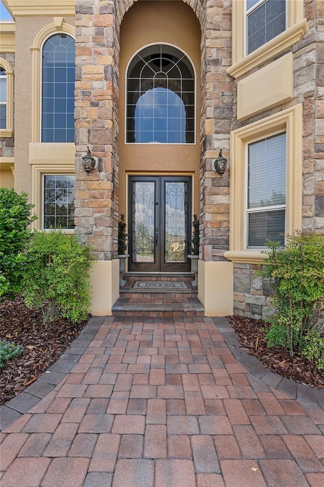 6542 Eagle Ridge Way, Lakeland, FL 33813 - entrance to property with french doors and stone siding