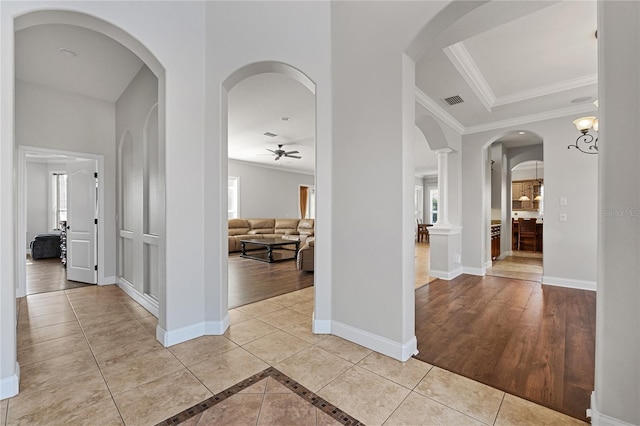 6542 Eagle Ridge Way, Lakeland, FL 33813 - hall featuring crown molding, light tile patterned floors, and baseboards