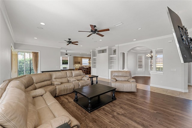 6542 Eagle Ridge Way, Lakeland, FL 33813 - living area featuring arched walkways, ceiling fan, light wood-style flooring, a chandelier, and recessed lighting