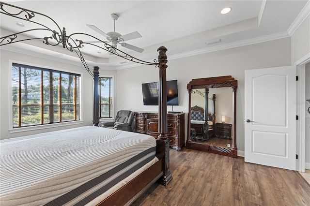 6542 Eagle Ridge Way, Lakeland, FL 33813 - bedroom with a raised ceiling, wood finished floors, crown molding, baseboards, and recessed lighting