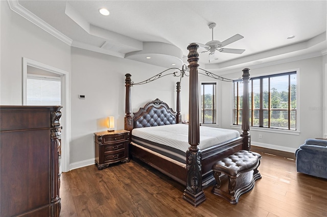 6542 Eagle Ridge Way, Lakeland, FL 33813 - bedroom featuring baseboards, dark wood finished floors, a raised ceiling, crown molding, and a ceiling fan