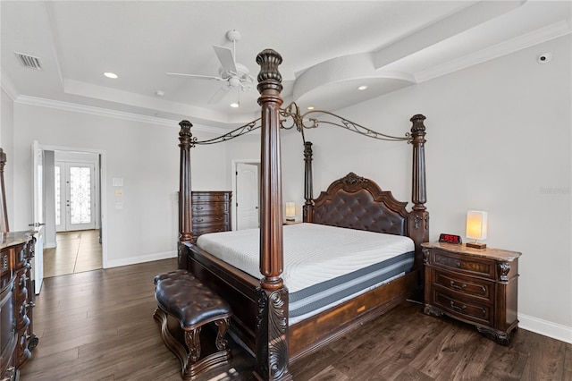 6542 Eagle Ridge Way, Lakeland, FL 33813 - bedroom with a raised ceiling, baseboards, dark wood-style flooring, crown molding, and recessed lighting