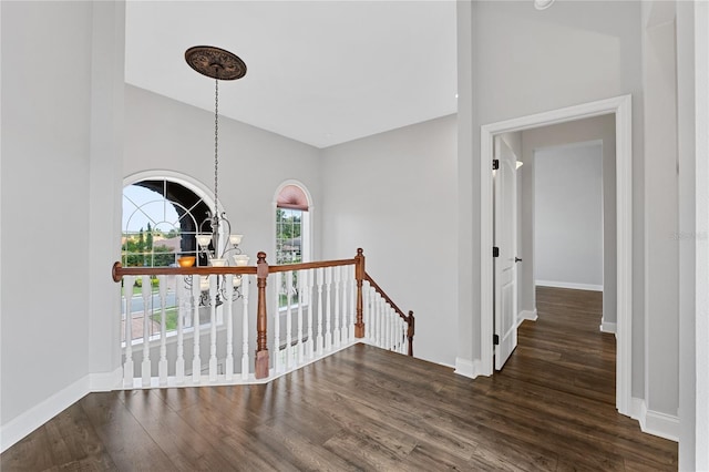6542 Eagle Ridge Way, Lakeland, FL 33813 - hallway with an upstairs landing, wood finished floors, and baseboards