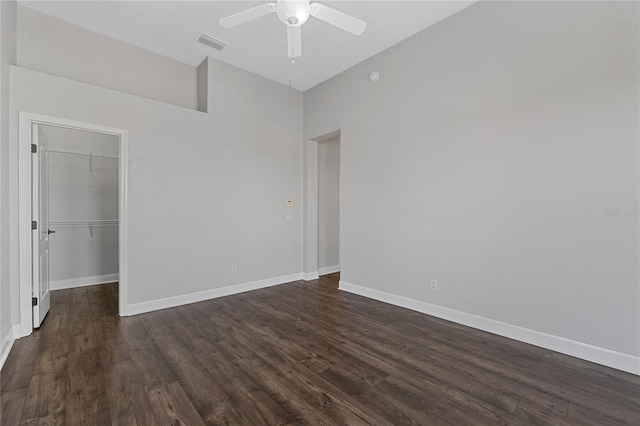 6542 Eagle Ridge Way, Lakeland, FL 33813 - empty room featuring dark wood finished floors, ceiling fan, and baseboards