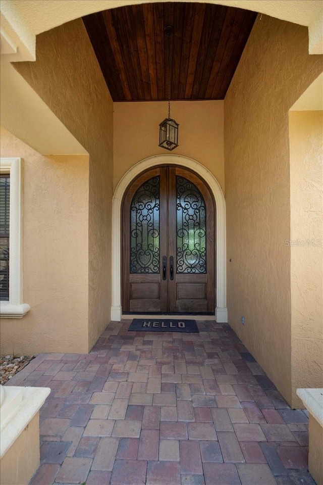 6357 Ashley Dr, Lakeland, FL 33813 - entrance to property featuring french doors and stucco siding