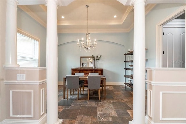 6357 Ashley Dr, Lakeland, FL 33813 - dining area featuring ornate columns, dark stone finish flooring, crown molding, baseboards, and a chandelier