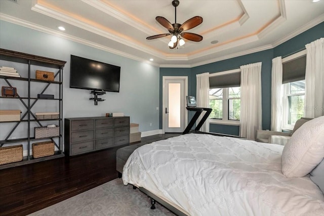 6357 Ashley Dr, Lakeland, FL 33813 - bedroom with a raised ceiling, ornamental molding, and wood finished floors