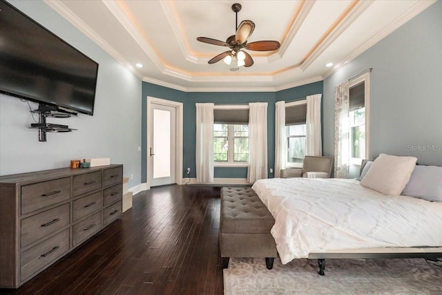 6357 Ashley Dr, Lakeland, FL 33813 - bedroom with dark wood finished floors, a raised ceiling, ornamental molding, baseboards, and a ceiling fan