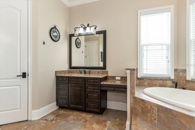 6357 Ashley Dr, Lakeland, FL 33813 - full bathroom featuring a garden tub, vanity, healthy amount of natural light, ornamental molding, and baseboards