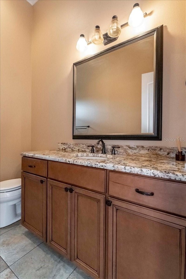 6357 Ashley Dr, Lakeland, FL 33813 - bathroom featuring vanity, toilet, and tile patterned floors
