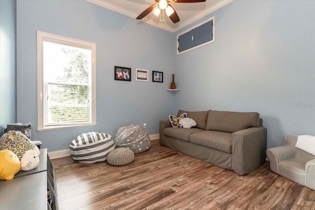 6357 Ashley Dr, Lakeland, FL 33813 - living area with ornamental molding, wood finished floors, ceiling fan, and baseboards
