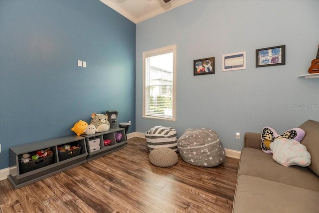 6357 Ashley Dr, Lakeland, FL 33813 - game room featuring ornamental molding, baseboards, wood finished floors, and a ceiling fan