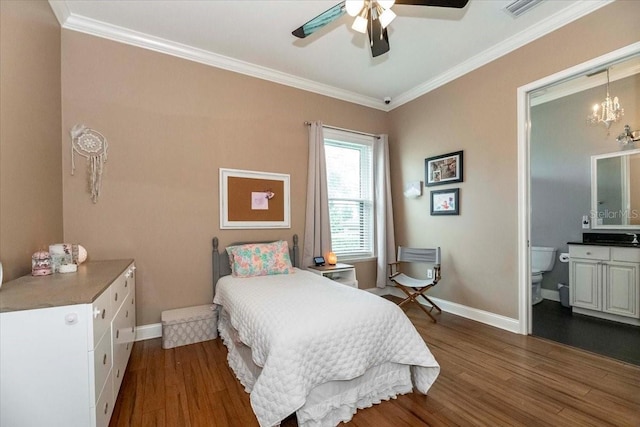 6357 Ashley Dr, Lakeland, FL 33813 - bedroom featuring dark wood finished floors, ornamental molding, baseboards, a chandelier, and ensuite bathroom