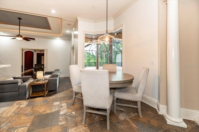 6357 Ashley Dr, Lakeland, FL 33813 - dining space featuring crown molding, decorative columns, stone finish flooring, baseboards, and a ceiling fan