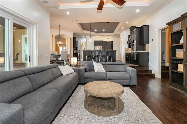 6357 Ashley Dr, Lakeland, FL 33813 - living area with a ceiling fan, ornamental molding, a raised ceiling, dark wood-style flooring, and recessed lighting