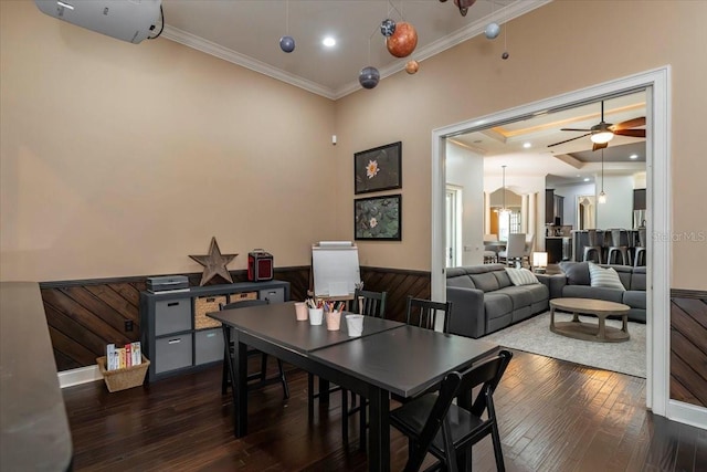 6357 Ashley Dr, Lakeland, FL 33813 - dining room featuring ornamental molding, hardwood / wood-style flooring, wainscoting, and ceiling fan