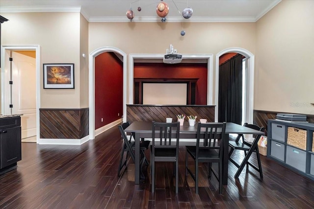 6357 Ashley Dr, Lakeland, FL 33813 - dining area with wood finished floors, arched walkways, crown molding, and baseboards