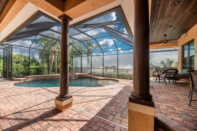 6357 Ashley Dr, Lakeland, FL 33813 - view of swimming pool with a patio, ceiling fan, a pool with connected hot tub, and glass enclosure