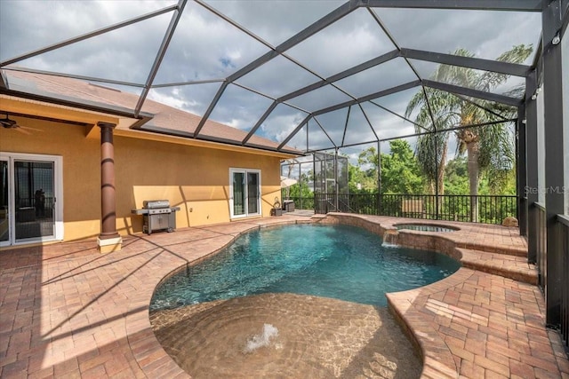 6357 Ashley Dr, Lakeland, FL 33813 - view of pool with a grill, a patio, a pool with connected hot tub, and ceiling fan