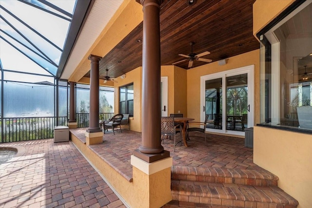 6357 Ashley Dr, Lakeland, FL 33813 - view of patio featuring a ceiling fan, outdoor dining area, and glass enclosure