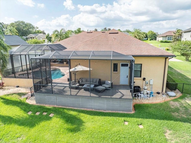 6357 Ashley Dr, Lakeland, FL 33813 - back of property featuring a patio, outdoor lounge area, stucco siding, and glass enclosure