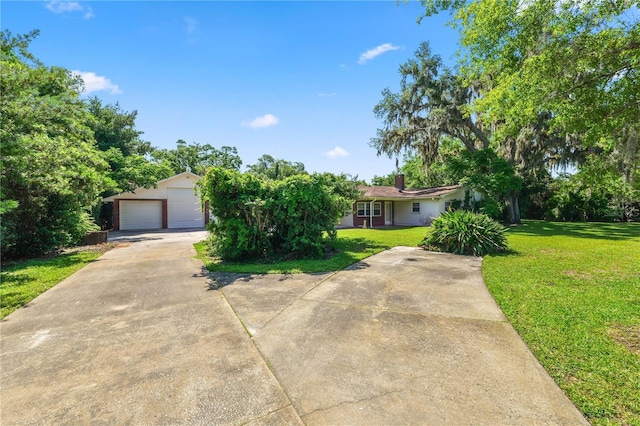 5425 Lewellyn Rd, Lakeland, FL 33810 - view of front of home with a garage and a front yard