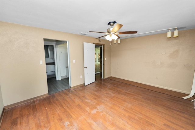 5425 Lewellyn Rd, Lakeland, FL 33810 - spare room with a ceiling fan, light wood-style floors, and baseboards