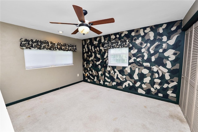 5425 Lewellyn Rd, Lakeland, FL 33810 - empty room featuring carpet, plenty of natural light, a ceiling fan, and baseboards
