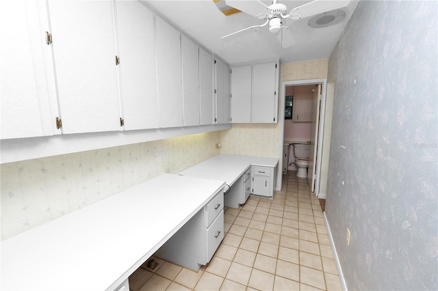 5425 Lewellyn Rd, Lakeland, FL 33810 - unfurnished office with built in study area, light tile patterned flooring, ceiling fan, wallpapered walls, and baseboards