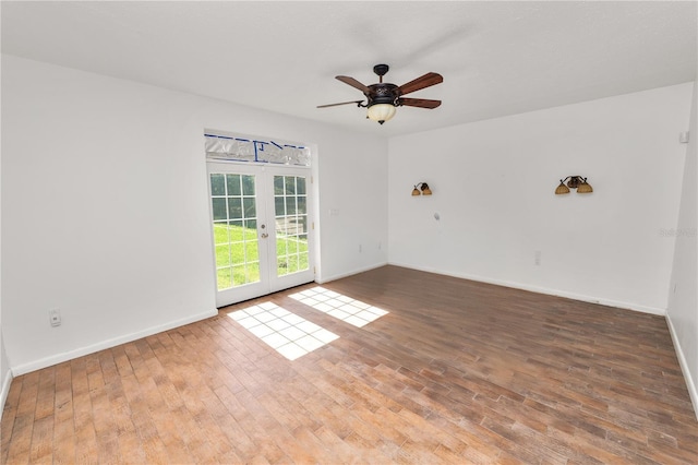 5425 Lewellyn Rd, Lakeland, FL 33810 - unfurnished room featuring french doors, baseboards, wood finished floors, and a ceiling fan