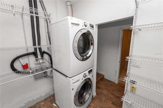 5425 Lewellyn Rd, Lakeland, FL 33810 - washroom with stacked washer and clothes dryer and dark wood-style flooring