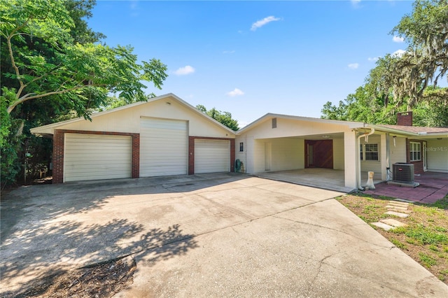 5425 Lewellyn Rd, Lakeland, FL 33810 - ranch-style home with a garage, a chimney, brick siding, and an outbuilding