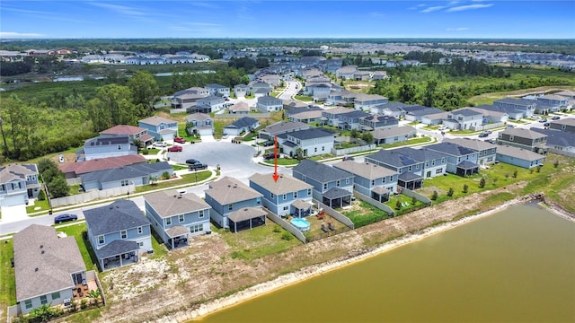 aerial view of residential area with a nearby body of water
