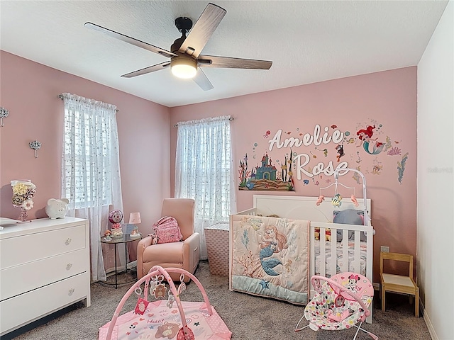 bedroom featuring carpet floors, multiple windows, and ceiling fan