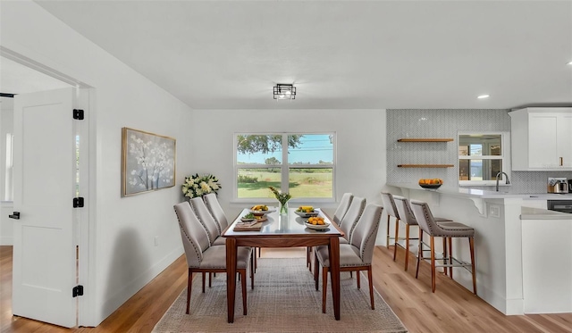 6543 Tula Ln, Lakeland, FL 33809 - dining room with light wood-type flooring, plenty of natural light, baseboards, and recessed lighting