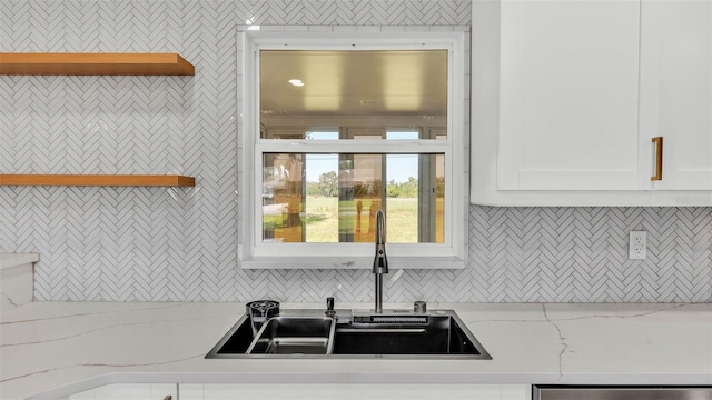 6543 Tula Ln, Lakeland, FL 33809 - kitchen with a sink, open shelves, white cabinetry, tasteful backsplash, and dishwasher
