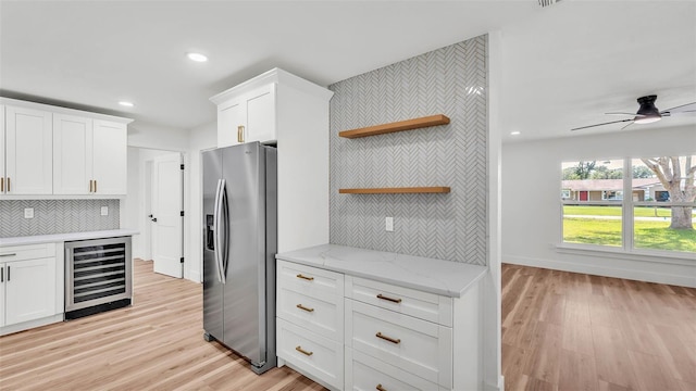 6543 Tula Ln, Lakeland, FL 33809 - kitchen featuring beverage cooler, stainless steel fridge with ice dispenser, open shelves, recessed lighting, and white cabinetry