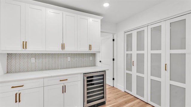 6543 Tula Ln, Lakeland, FL 33809 - bar area with wine cooler, recessed lighting, backsplash, and light wood-style floors