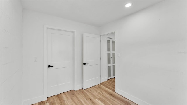 6543 Tula Ln, Lakeland, FL 33809 - unfurnished bedroom featuring light wood-style flooring, baseboards, and recessed lighting