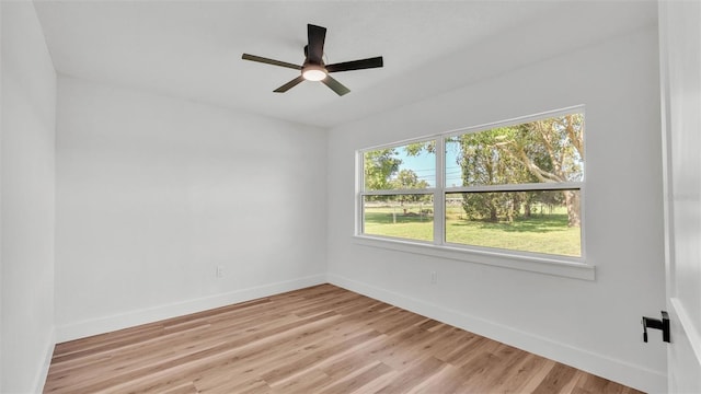 6543 Tula Ln, Lakeland, FL 33809 - empty room with baseboards, light wood-style flooring, and a ceiling fan