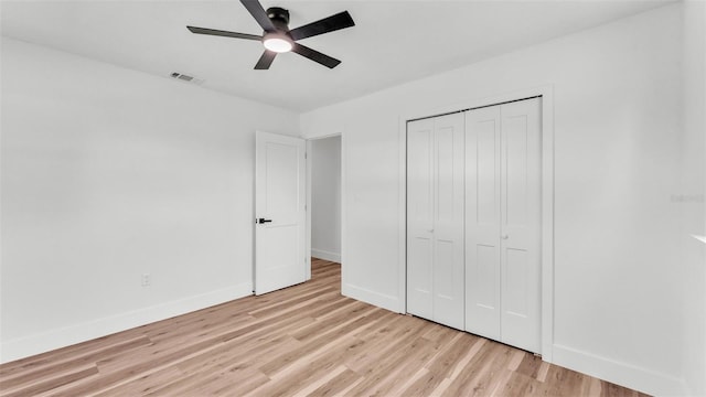 6543 Tula Ln, Lakeland, FL 33809 - unfurnished bedroom with light wood-style floors, baseboards, a closet, and ceiling fan