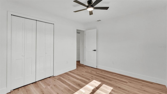 6543 Tula Ln, Lakeland, FL 33809 - unfurnished bedroom featuring baseboards, light wood-style flooring, a closet, and ceiling fan