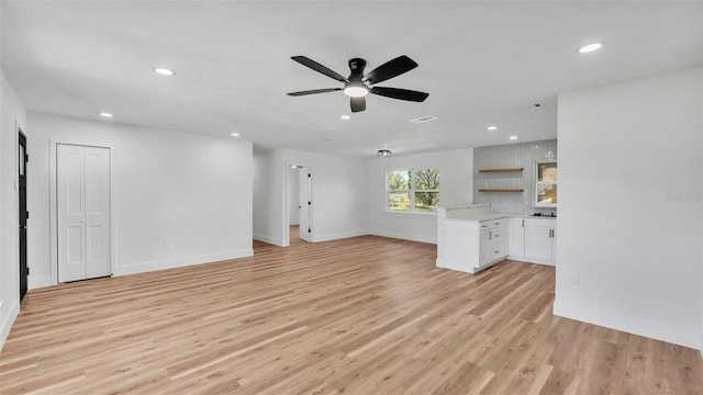 6543 Tula Ln, Lakeland, FL 33809 - unfurnished living room with recessed lighting, ceiling fan, light wood-style floors, and baseboards