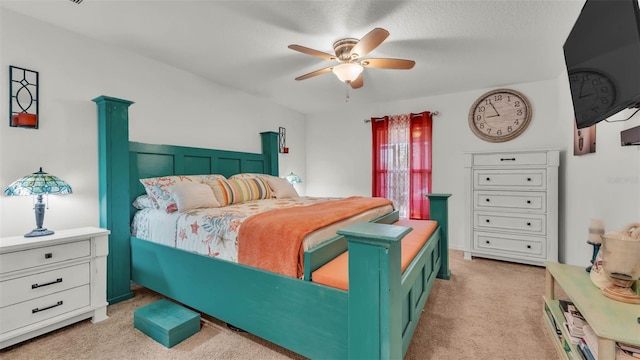 2293 Caspian Dr, Lakeland, FL 33805 - bedroom with light carpet, ceiling fan, and a textured ceiling