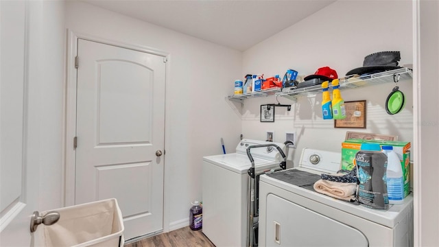 2293 Caspian Dr, Lakeland, FL 33805 - laundry area with separate washer and dryer and light wood finished floors
