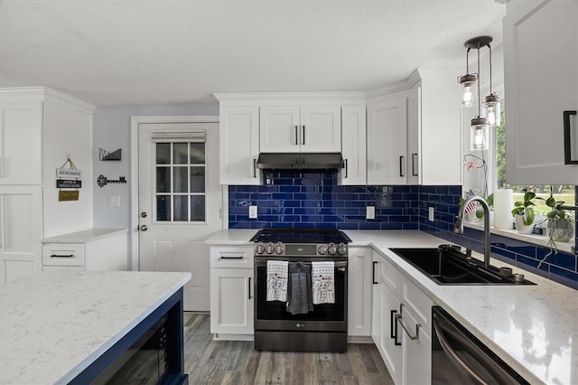 3810 Harrelson Rd, Lakeland, FL 33810 - kitchen featuring stainless steel range with electric cooktop, under cabinet range hood, a sink, white cabinets, and a textured ceiling