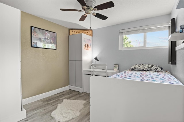 3810 Harrelson Rd, Lakeland, FL 33810 - bedroom with light wood-style flooring, ceiling fan, and baseboards