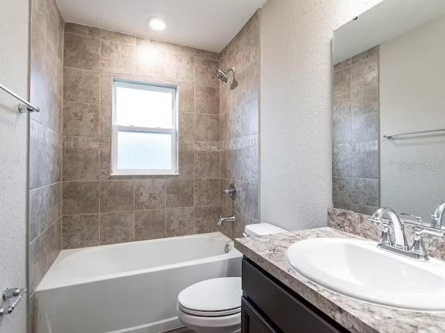 5381 SE 129th Ln, Belleview, FL 34420 - full bath with toilet, tub / shower combination, vanity, and a textured wall