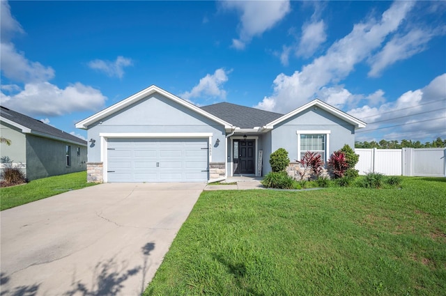 3883 Sandhill Crane Dr, Lakeland, FL 33811 - single story home with a garage, concrete driveway, stucco siding, and stone siding