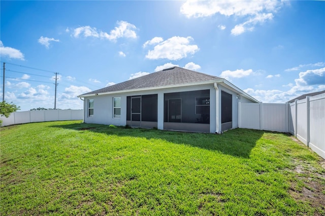 3883 Sandhill Crane Dr, Lakeland, FL 33811 - back of house featuring a sunroom and a shingled roof